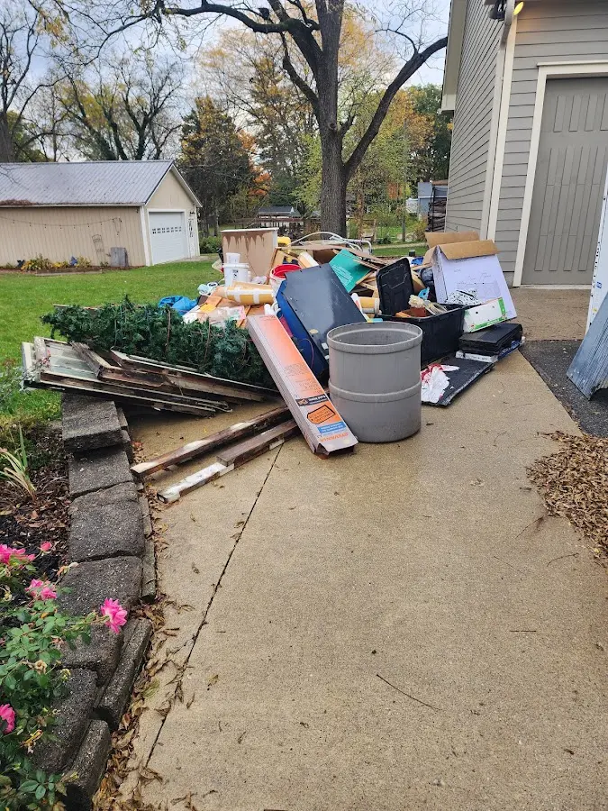 Dumpster being loaded with debris for Commercial Dumpster Rental in Delray Beach